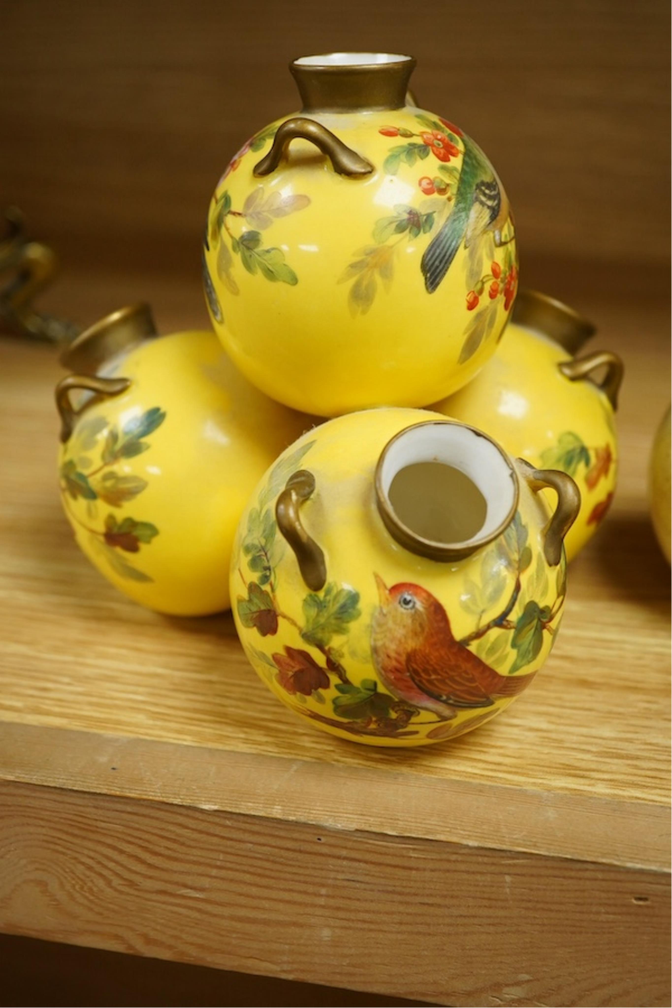 Three Royal Worcester 'pyramid' vases, painted with birds, 14cm high. Condition - fair/good